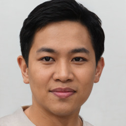 Joyful asian young-adult male with short  black hair and brown eyes