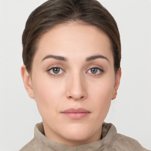 Neutral white young-adult female with short  brown hair and grey eyes