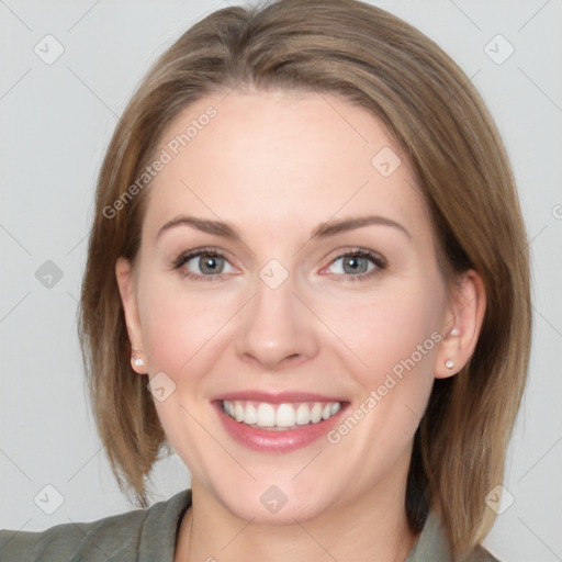 Joyful white young-adult female with medium  brown hair and grey eyes