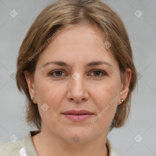 Joyful white adult female with medium  brown hair and brown eyes