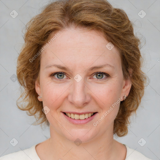 Joyful white young-adult female with medium  brown hair and blue eyes