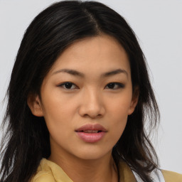 Neutral asian young-adult female with medium  brown hair and brown eyes