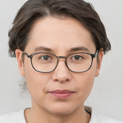 Joyful white adult female with short  brown hair and brown eyes