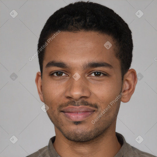 Joyful black young-adult male with short  brown hair and brown eyes