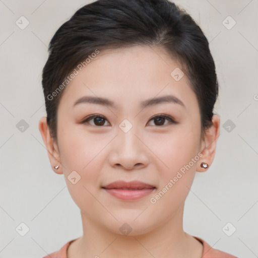 Joyful asian young-adult female with short  brown hair and brown eyes