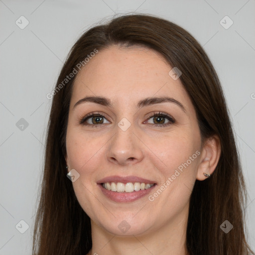 Joyful white young-adult female with long  brown hair and grey eyes