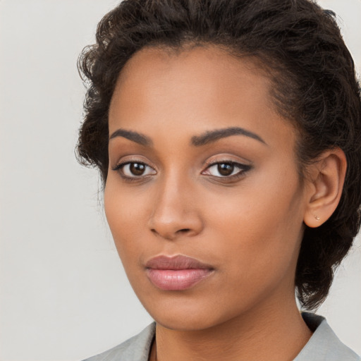 Neutral latino young-adult female with long  brown hair and brown eyes