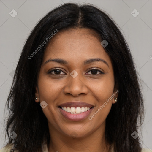 Joyful black young-adult female with long  brown hair and brown eyes