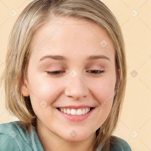 Joyful white young-adult female with medium  brown hair and blue eyes