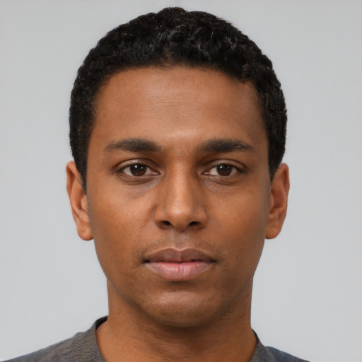 Neutral black young-adult male with short  black hair and brown eyes