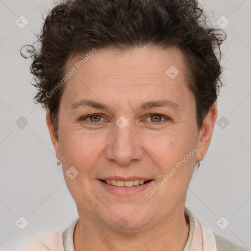 Joyful white adult female with short  brown hair and brown eyes