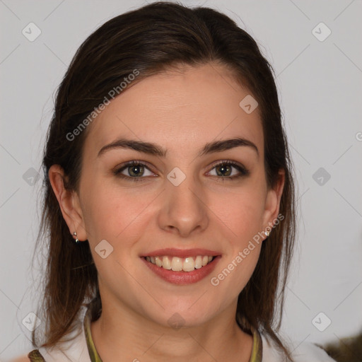 Joyful white young-adult female with medium  brown hair and brown eyes