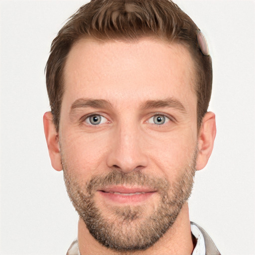 Joyful white adult male with short  brown hair and grey eyes