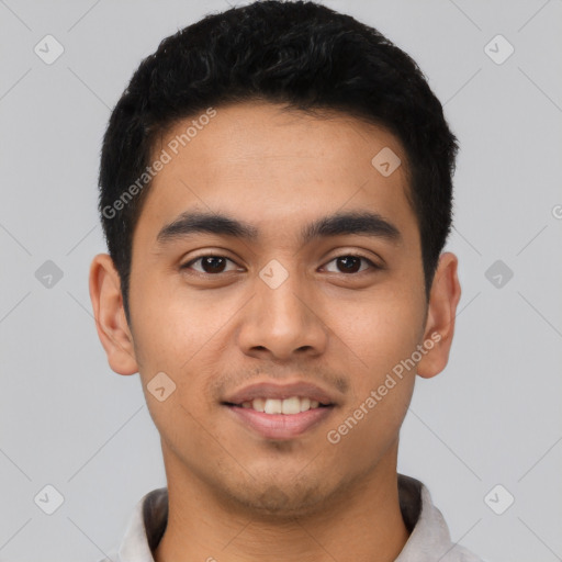 Joyful latino young-adult male with short  black hair and brown eyes