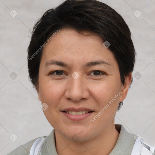 Joyful white adult female with short  brown hair and brown eyes