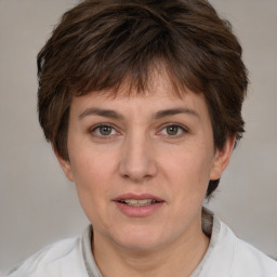 Joyful white adult female with short  brown hair and brown eyes