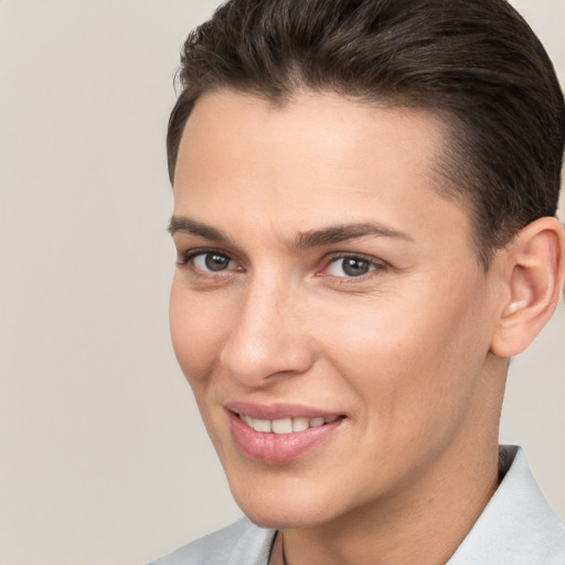 Joyful white young-adult female with short  brown hair and brown eyes