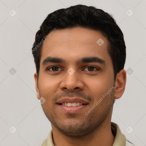 Joyful latino young-adult male with short  black hair and brown eyes