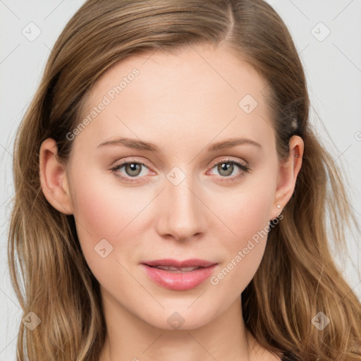 Joyful white young-adult female with long  brown hair and blue eyes