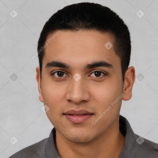 Joyful latino young-adult male with short  black hair and brown eyes