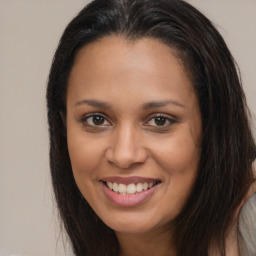 Joyful asian young-adult female with long  brown hair and brown eyes