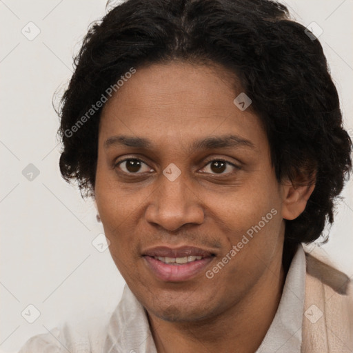 Joyful black adult female with short  brown hair and brown eyes
