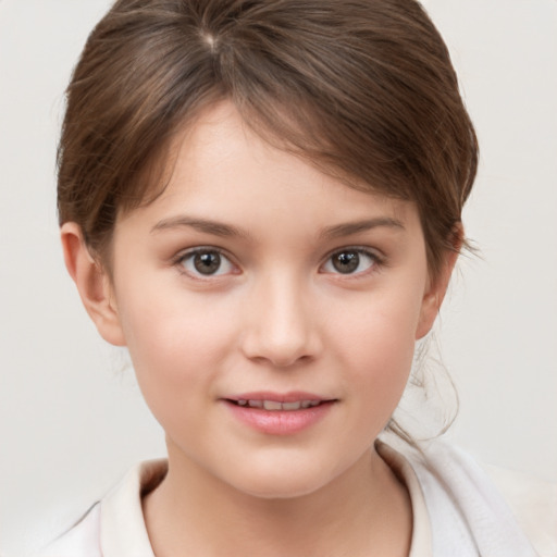 Joyful white child female with short  brown hair and brown eyes