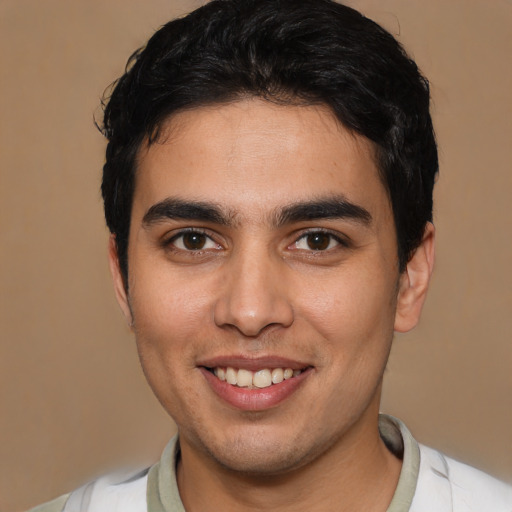 Joyful asian young-adult male with short  brown hair and brown eyes