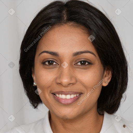 Joyful black young-adult female with medium  black hair and brown eyes