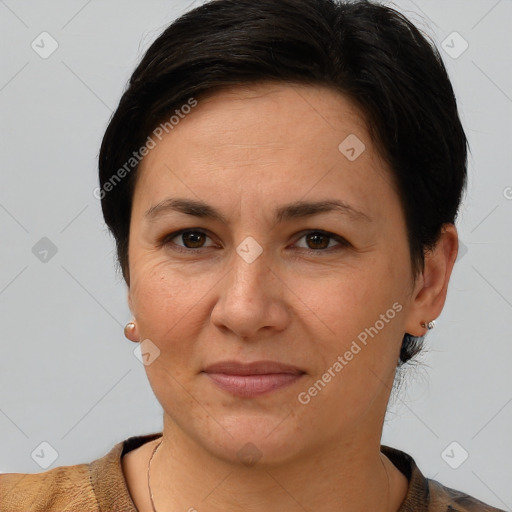 Joyful white adult female with short  brown hair and brown eyes