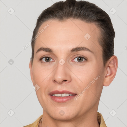 Joyful white adult female with short  brown hair and brown eyes