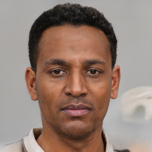 Neutral latino adult male with short  black hair and brown eyes