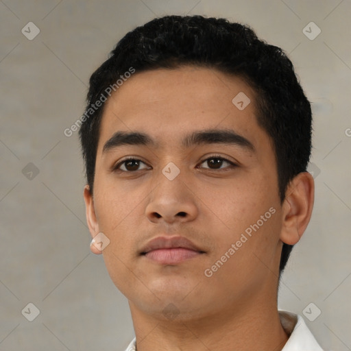 Neutral latino young-adult male with short  black hair and brown eyes