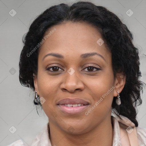 Joyful black adult female with medium  brown hair and brown eyes