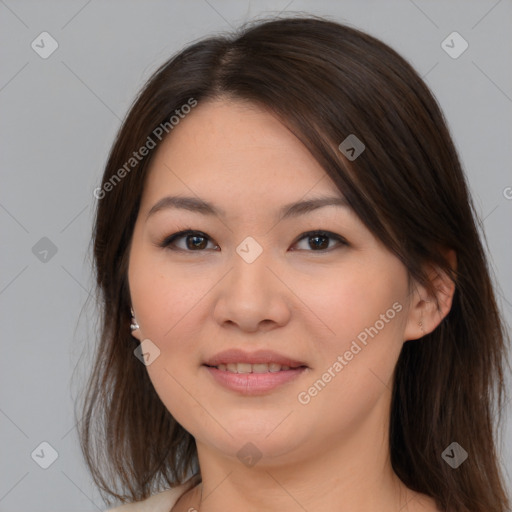 Joyful asian young-adult female with medium  brown hair and brown eyes