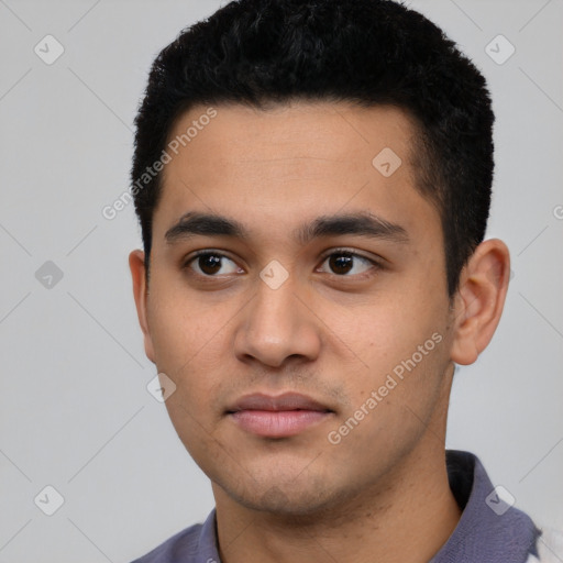 Neutral latino young-adult male with short  black hair and brown eyes