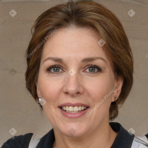 Joyful white adult female with medium  brown hair and blue eyes