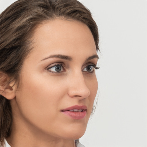 Neutral white young-adult female with medium  brown hair and grey eyes