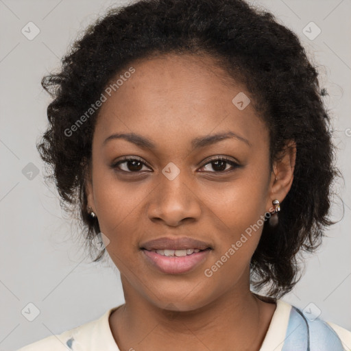 Joyful black young-adult female with long  brown hair and brown eyes