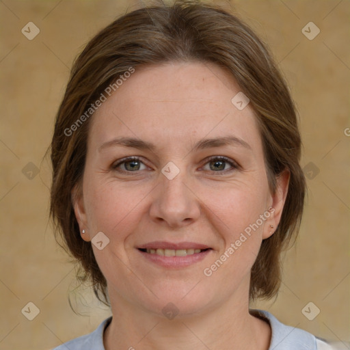 Joyful white adult female with medium  brown hair and grey eyes