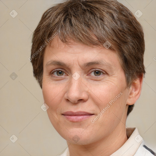 Joyful white adult female with short  brown hair and brown eyes