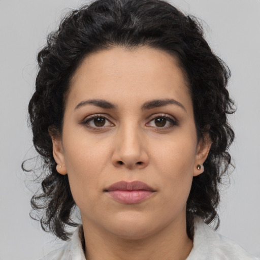 Neutral latino young-adult female with medium  brown hair and brown eyes