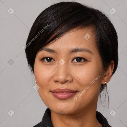 Joyful asian young-adult female with medium  black hair and brown eyes