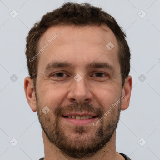 Joyful white adult male with short  brown hair and brown eyes