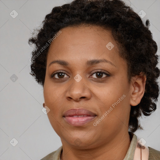 Joyful black adult female with short  brown hair and brown eyes