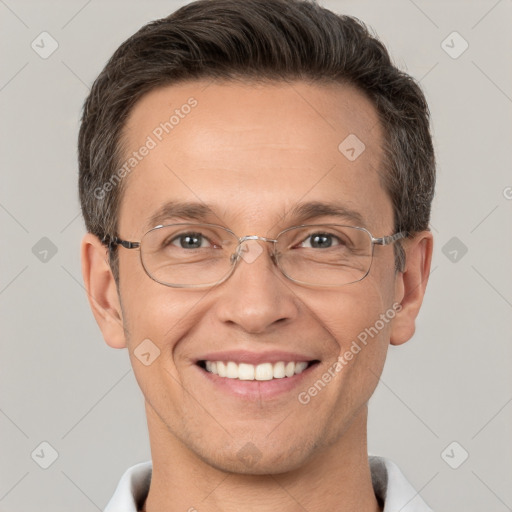 Joyful white adult male with short  brown hair and brown eyes