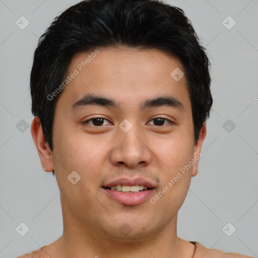 Joyful asian young-adult male with short  brown hair and brown eyes