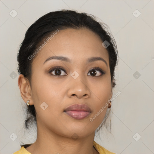 Joyful latino young-adult female with long  brown hair and brown eyes
