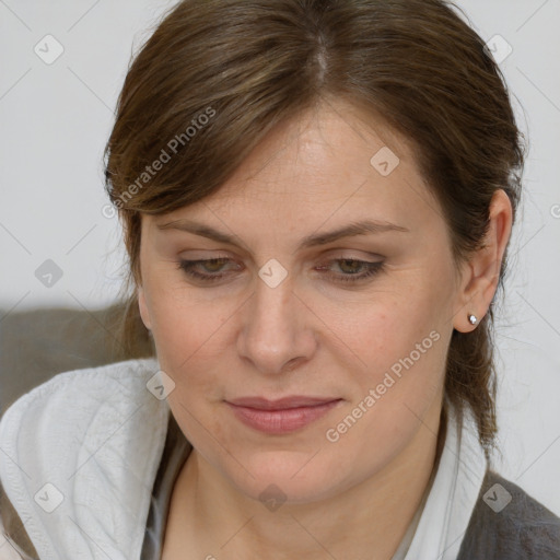 Joyful white adult female with medium  brown hair and brown eyes