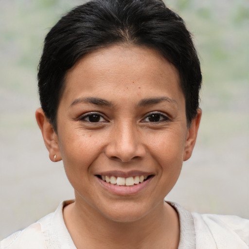 Joyful white young-adult female with short  brown hair and brown eyes